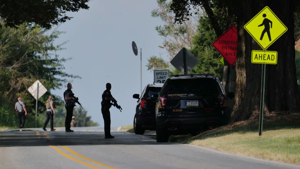 Police stand guard on the perimeter of a search zone on Friday in Kennett Square, Pennsylvania.  - Spencer Platt/Getty Images