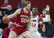 Indiana forward Joey Brunk (50) moves the ball as Rutgers forward Shaq Carter (13) defends during the first half of an NCAA college basketball game, Wednesday, Jan. 15, 2020 in Piscataway, N.J. (Andrew Mills/NJ Advance Media via AP)