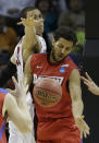 Dayton forward Devin Oliver (5) works against Stanford forward Dwight Powell (33) during the second half in a regional semifinal game at the NCAA college basketball tournament, Thursday, March 27, 2014, in Memphis, Tenn. (AP Photo/Mark Humphrey)