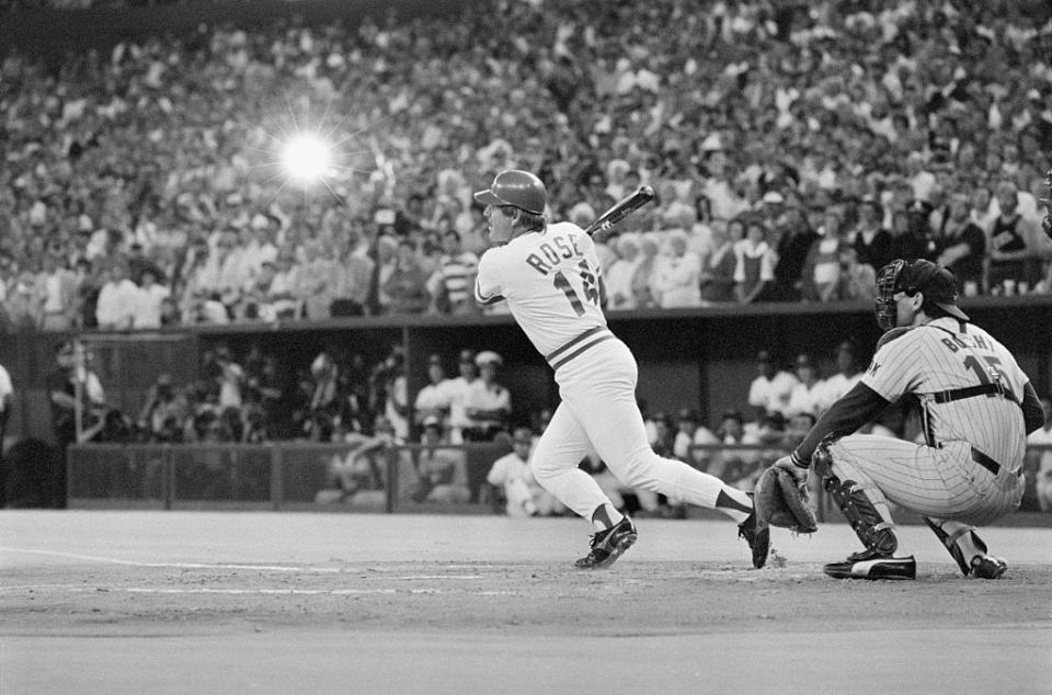 The spotlight is on Pete Rose as he connects for hit 4,192 and a new baseball career hit record, in Cincinnati, Ohio, on Sept. 11, 1985. <br><span class="copyright">Bettmann Archive/Getty Images</span>