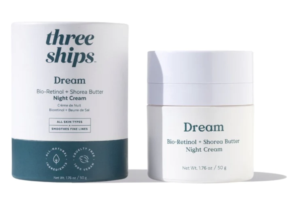 white tub of night cream next to product box