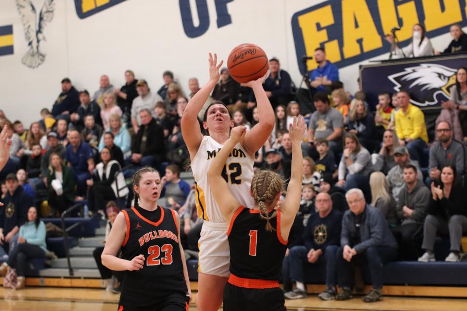 Erie Mason's Lizzie Liedel takes a shot against Summerfield defenders Abby Haller (23) and Ava Fisher (1) on Thursday, January 27, 2022.