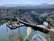 A view shows the Copco 1 Dam in Hornbrook, Calif., Sunday, Sept. 17, 2023. The dam is one of a series of four dams along the Klamath River which are part of the largest dam removal project in United States history. Now underway along the Oregon border, the process won't conclude until the end of next year with the help of heavy machinery and explosives. (AP Photo/Haven Daley)