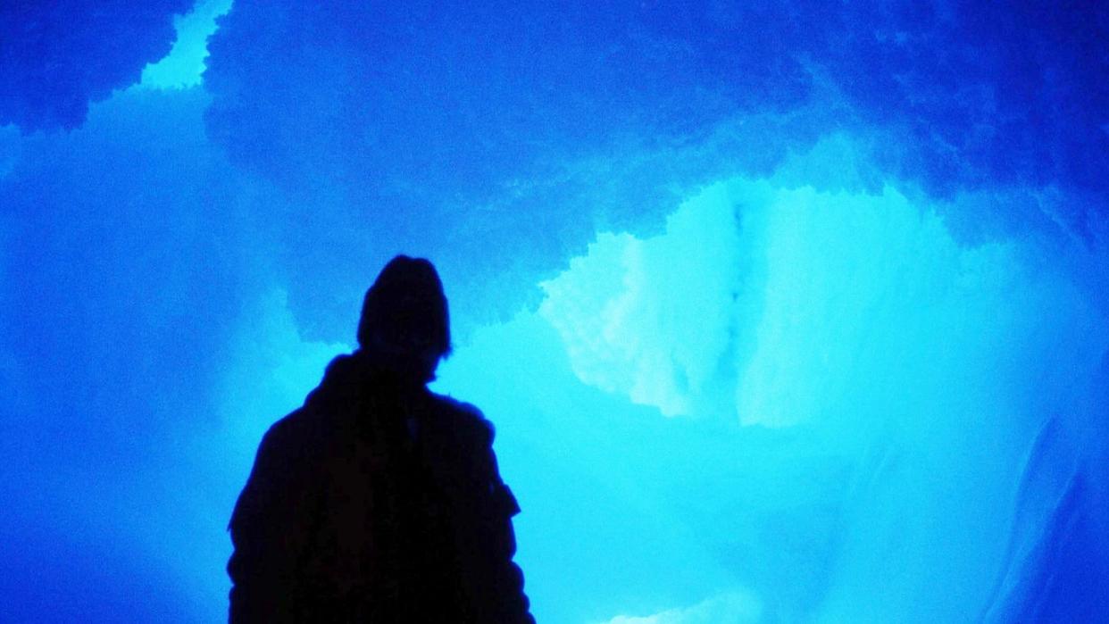 man in ice cave