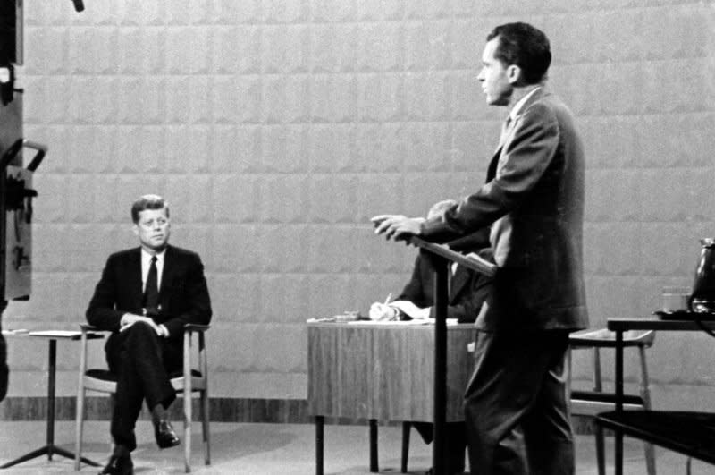 John F. Kennedy looks on while Richard Nixon speaks during their Sept. 26, 1960, televised U.S. presidential debate in Chicago. On Nov. 8, Kennedy was elected president. File Photo/UPI