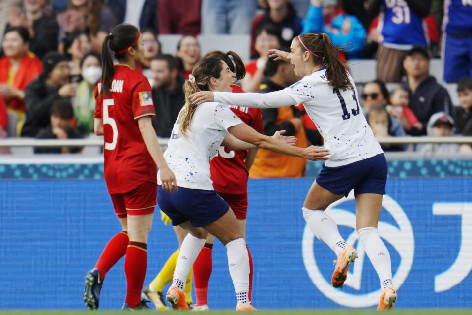 United States' Alex Morgan (13) and Savannah DeMelo (9) celebrate a goal by teammate Sophia Smith during the first half of the Women's World Cup Group E soccer match between the United States and Vietnam at Eden Park in Auckland, New Zealand, Saturday, July 22, 2023. (AP Photo/Abbie Parr)