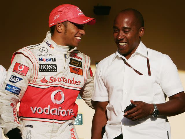 <p>Mark Thompson/Getty</p> Lewis Hamilton celebrates with his father Anthony Hamilton following his second place finish in the Bahrain Formula One Grand Prix at the Bahrain International Circuit on April 15, 2007.