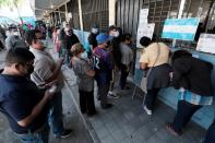 People cast their vote during general elections, in San Pedro Sula