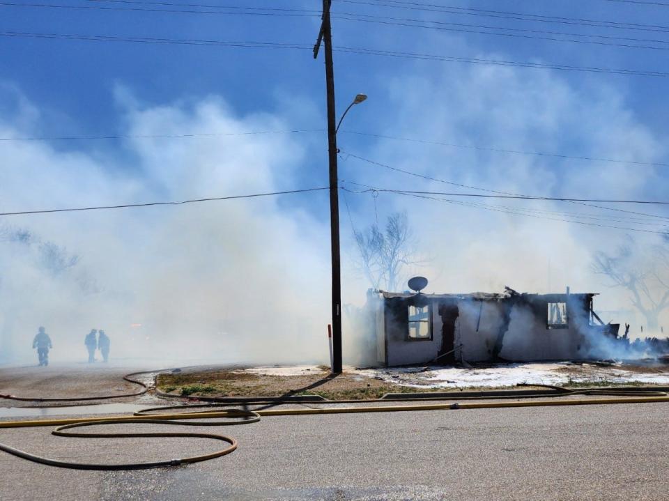 Amarillo firefighters battle a fire involving two structures near NW 3rd and N Jefferson near downtown Amarillo on Friday afternoon.