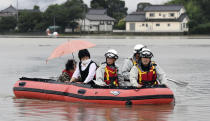 <p>Residents are rescued by boat after heavy rain isolated an area in Asakura, Fukuoka prefecture, southwestern Japan Thursday, July 6, 2017. Heavy rain following a recent typhoon flooded many houses in southwestern Japan, forcing thousands of people to flee, authorities said. (Photo: Sadayuki Goto/Kyodo News via AP) </p>