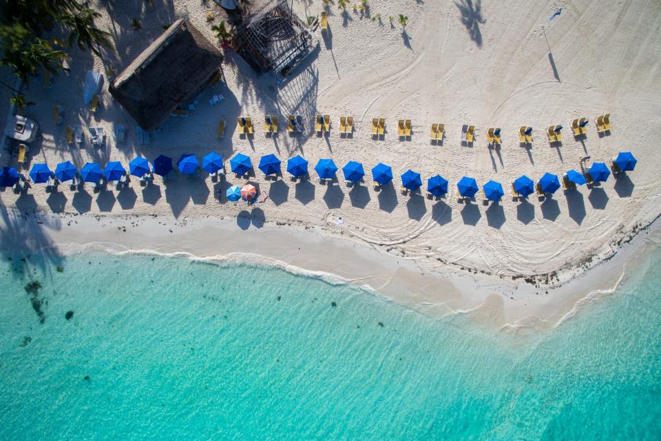 Umbrellas on the beach of Isla Mujeres - Aerial view