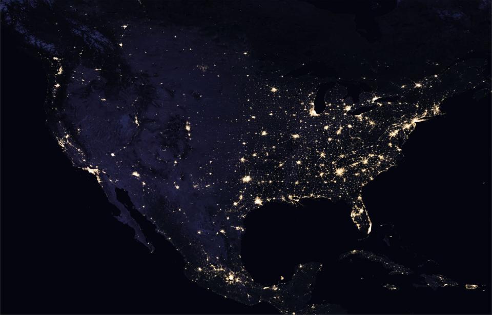 Satellite image of U.S. at night with cities brightly lit