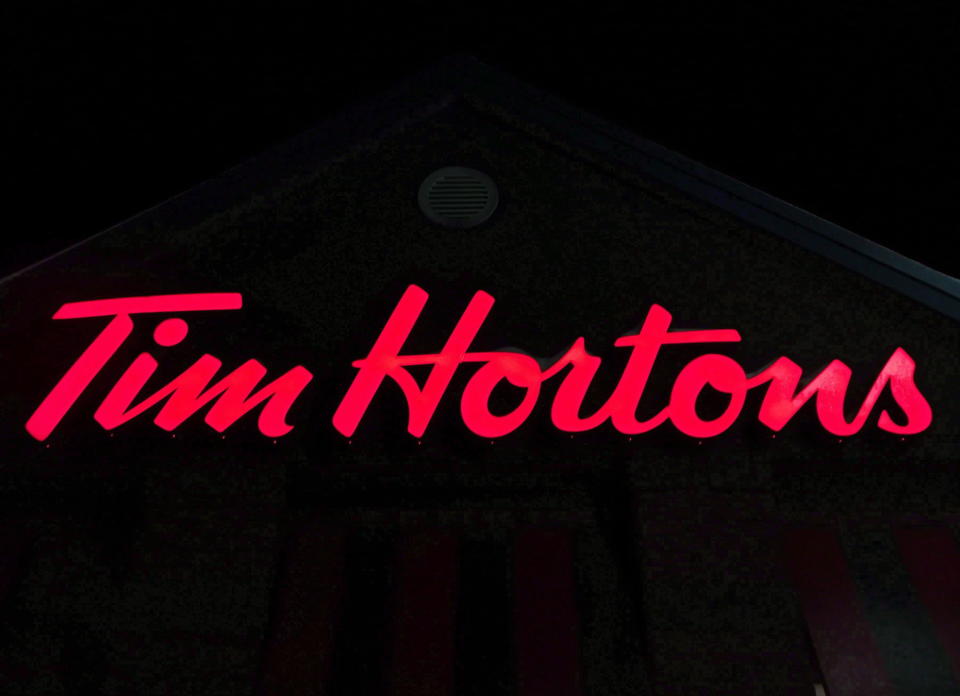 A Tim Hortons restaurant sign is shown in Newcastle, Ont. on Sunday Feb. 11, 2018. Restaurant Brands International Inc. reported its fourth-quarter net income more than doubled compared with a year ago.THE CANADIAN PRESS/Doug Ives