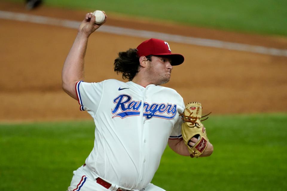 Texas Rangers relief pitcher Ian Gibaut throws to the Oakland Athletics in the seventh inning of a baseball game in Arlington, Texas, Tuesday, Aug. 25, 2020. (AP Photo/Tony Gutierrez)