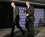 NBA Commissioner Adam Silver, left, walks away after a news conference in New York, Tuesday, April 29, 2014. Silver announced that Los Angeles Clippers owner Donald Sterling has been banned for life by the league in response to racist comments the league says he made in a recorded conversation. (AP Photo/Kathy Willens)