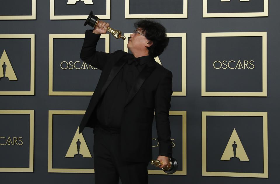 Bong Joon Ho poses with two Oscars, one for Best Director and one for Best International Feature Film for "Parasite" in the photo room during the 92nd Academy Awards in Hollywood, Los Angeles, California, U.S., February 9, 2020. REUTERS/Lucas Jackson