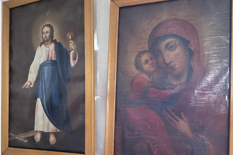 Icons and other religious artifacts are seen inside the old St. Nicholas Church in Eklutna, Alaska, on Oct. 13, 2023. A restoration effort has begun on the church, which is the oldest standing building in the Municipality of Anchorage. (AP Photo/Mark Thiessen)