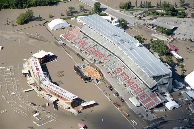 A flooded Calgary Stampede stadium is seen from a aerial view in Calgary Saturday, June 22, 2013. Environment Canada says floods were big newsmakers in Canada in 2013, and June's record flooding in Calgary and southern Alberta leads its Top 10 weather stories of the year. THE CANADIAN PRESS/Jonathan Hayward