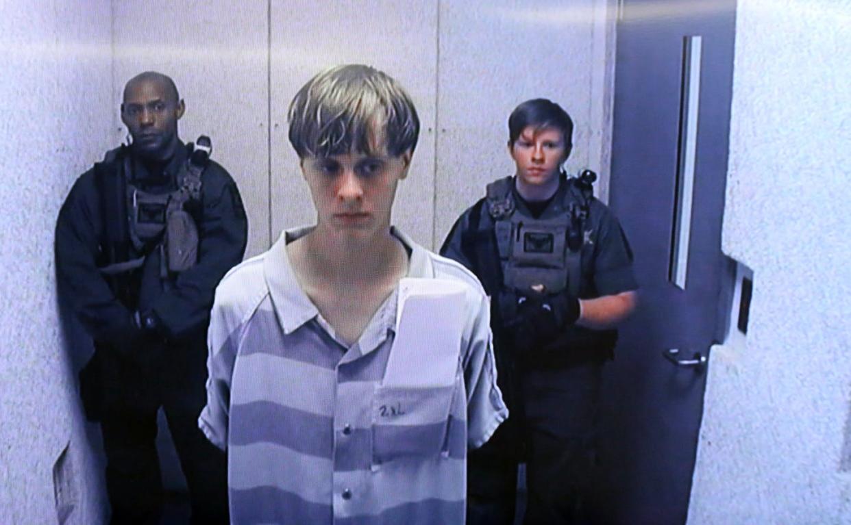 White nationalist Dylann Roof appears in court on June 19, 2015, after his arrest in the mass shootings at a Black church in South Carolina. <a href="https://www.gettyimages.com/detail/news-photo/in-this-image-from-the-video-uplink-from-the-detention-news-photo/477782306?adppopup=true" rel="nofollow noopener" target="_blank" data-ylk="slk:Grace Beahm-Pool/Getty Images;elm:context_link;itc:0;sec:content-canvas" class="link "> Grace Beahm-Pool/Getty Images</a>
