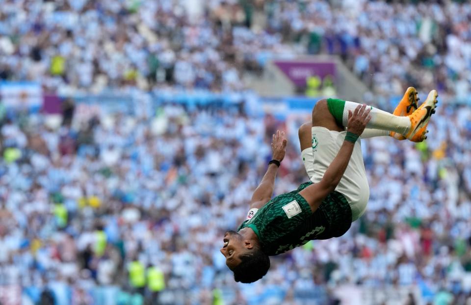 Saudi Arabia's Salem Al-Dawsari celebrates after scoring his side's second goal during the World Cup group C football match between Argentina and Saudi Arabia at the Lusail Stadium in Lusail, Qatar, Tuesday, Nov. 22, 2022. (AP Photo/Ricardo Mazalan)