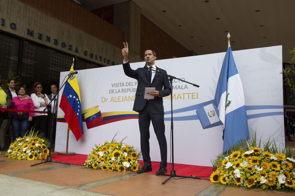 National Assembly President and self-proclaimed interim president of Venezuela Juan Guaido speaks during a press conference after Guatemala's president elect Alejandro Giammattei was denied entry into Venezuela, at the Metropolitan University in Caracas, Venezuela, Saturday, October 12, 2019. Giammattei said he landed early Saturday at the airport near Caracas, but officials denied his entry, escorting him to a departing plane. (AP Photo/Andrea Hernandez Briceño)