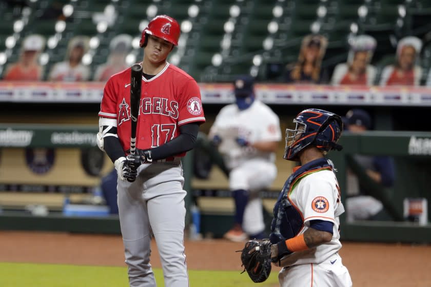 Los Angeles Angels designated hitter Shohei Ohtani (17) reacts to a strike call during a baseball game against the Houston Astros Monday, Aug. 24, 2020, in Houston. (AP Photo/Michael Wyke)