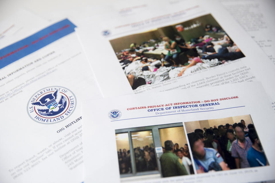 A report from government auditors reveals images of people penned into overcrowded Border Patrol facilities, including one man pressing a cardboard sign to a cell window with the word "help." is photographed at the Associated Press Bureau, Tuesday, July 2, 2019, in Washington. The report released Tuesday by the Department of Homeland Security's Office of Inspector General warns that facilities in South Texas' Rio Grande Valley face "serious overcrowding" and require "immediate attention." (AP Photo/Andrew Harnik)