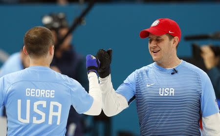 Curling - Pyeongchang 2018 Winter Olympics - Men's Semi-final - Canada v U.S. - Gangneung Curling Center - Gangneung, South Korea - February 22, 2018 - Vice-skip Tyler George and skip John Shuster of the U.S. gesture during the game. REUTERS/Phil Noble