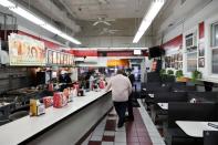 FILE PHOTO: Workers organize a few online orders at Ben's Chili Bowl as the restaurant navigates the coronavirus disease (COVID-19) outbreak in Washington