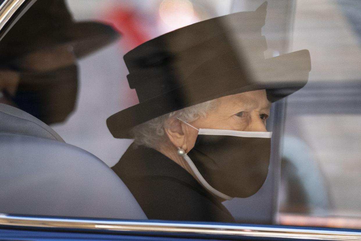 <p>The Queen was forced to sit alone during the socially distanced service at St George’s Chapel </p> (PA Wire)