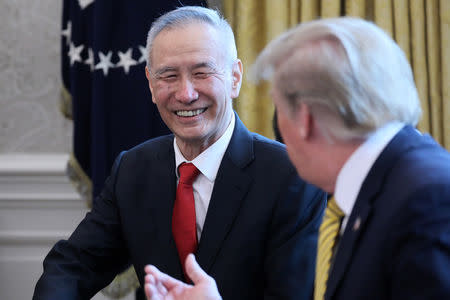 U.S. President Donald Trump speaks to China's Vice Premier Liu He during their meeting in the Oval Office of the White House in Washington, U.S., April 4, 2019. REUTERS/Jonathan Ernst