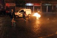 Demonstrators take part in a protest against the increase in the subway ticket prices in Santiago