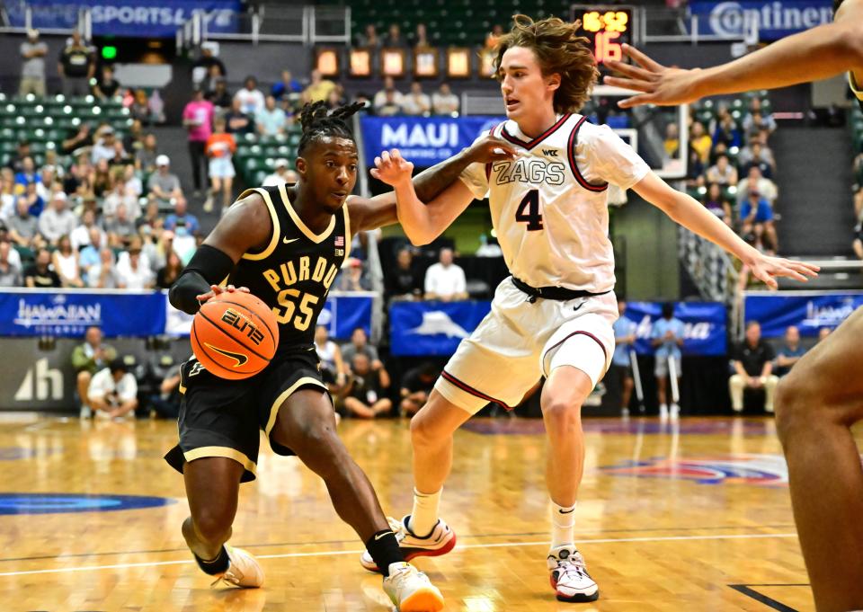 Nov 20, 2023; Honolulu, Hawaii, USA; 

Purdue Boilermakers guard Lance Jones (55) drives the ball downcourt while being defended by Gonzaga Bulldogs guard Dusty Stromer (4) during the first half at SimpliFi Arena at Stan Sheriff Center. Mandatory Credit: Steven Erler-USA TODAY Sports