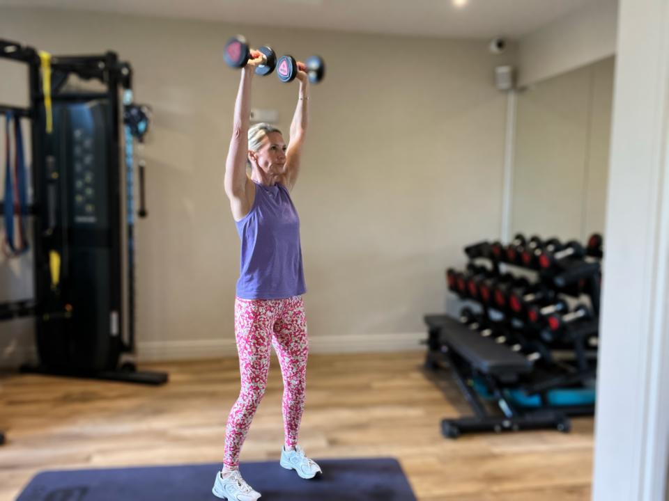 Caroline Idiens demonstrates shoulder press