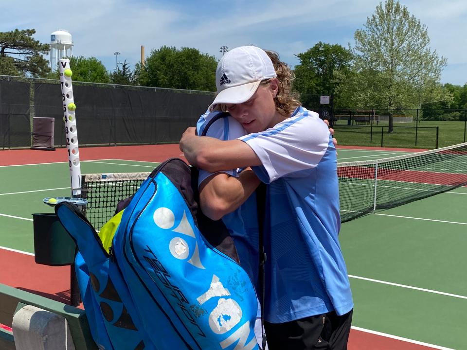 Salina Central's Collin and Connor Phelps share one last hug as teammates during the Class 5A state tennis tournament Saturday, May 14, 2022, at Kossover Tennis Complex in Topeka.
