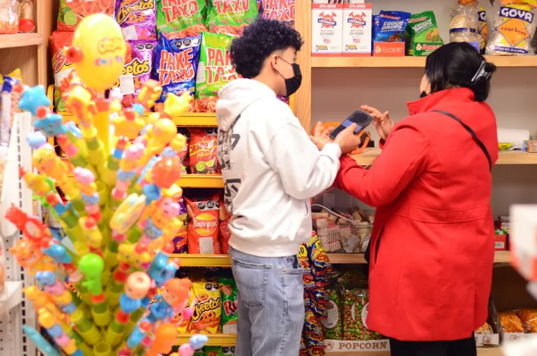 Jacqueline Martínez and her son Alejandro Martínez shop at Luna’s Groceries in Madison on March 10. The store’s opening in 2019 provided fresh food to a neighborhood that had been lacking a supermarket for nearly a decade.