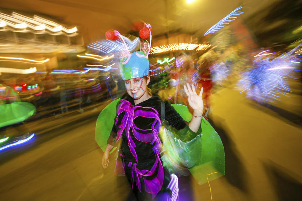 The Mystic Krewe of Nyx parade makes its way through the streets of New Orleans, Wednesday, Feb. 19, 2020. (AP Photo/Brett Duke)