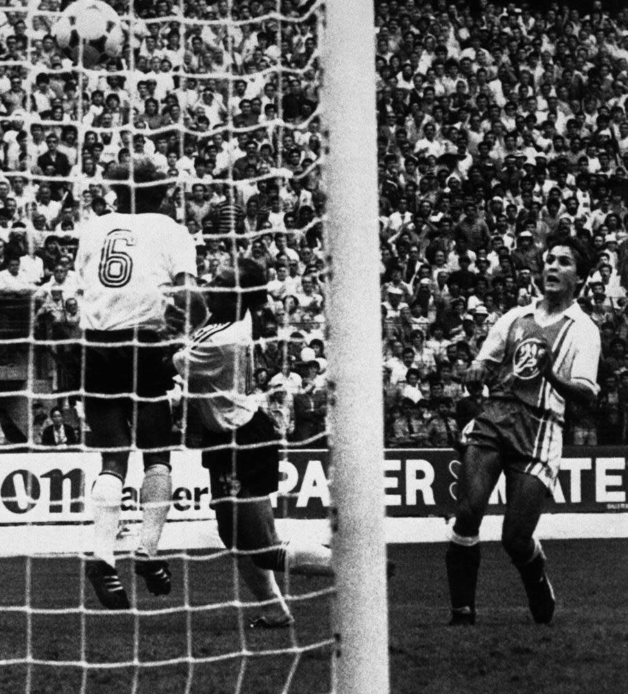 Rabah Madjer (right) scores Algeria’s first goal against West Germany.