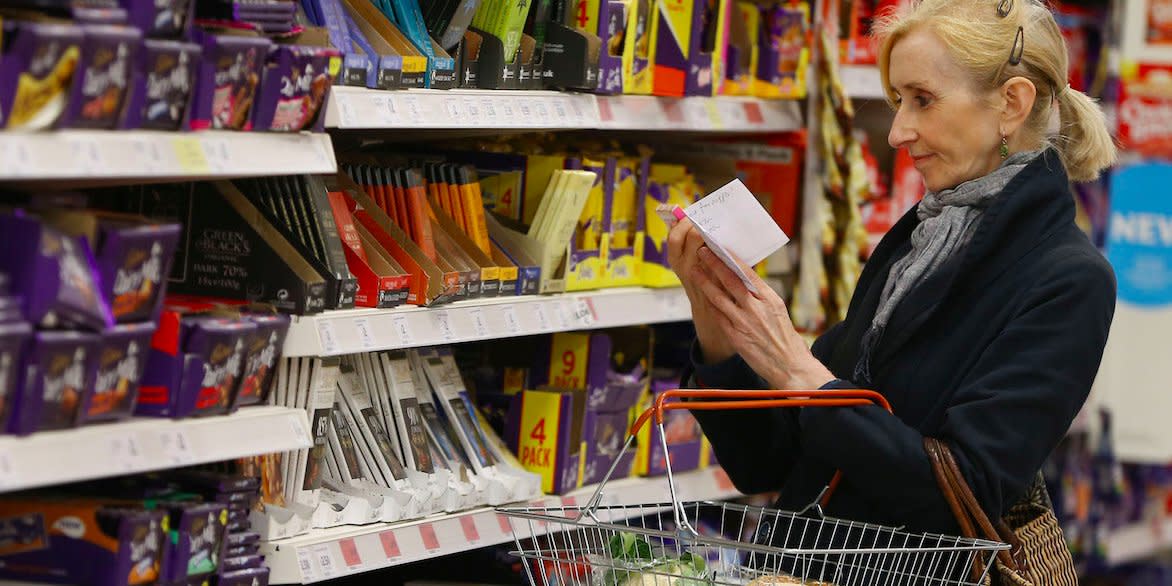 A shopper checks her shopping list in a supermarket in London, Britain April 11, 2017. British inflation shot past the Bank of England's 2 percent target last month, potentially adding to uneasiness among some officials at the central bank about keeping interest rates near zero. Consumer prices rose by a stronger-than-expected 2.3 percent, the biggest annual increase in nearly three-and-a-half years, pushed up by an increase in global oil prices and the impact of the Brexit vote on sterling.