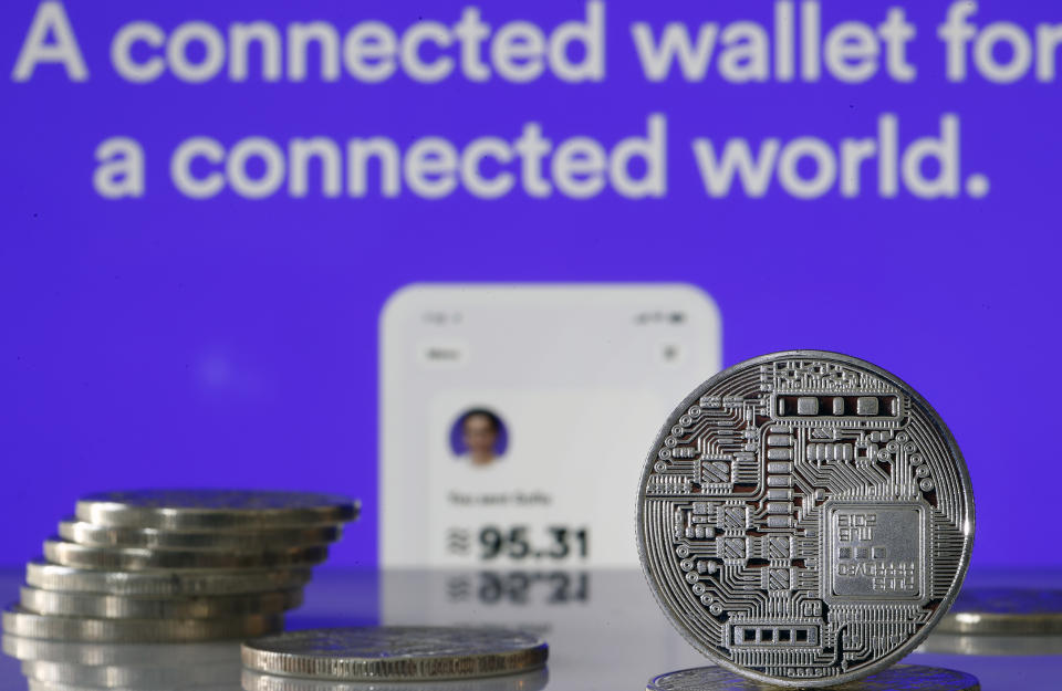 PARIS, FRANCE - JULY 08: In this photo illustration, a visual representation of digital cryptocurrency coins sit on display in front the website home page Calibra on July 08, 2019 in Paris, France. Calibra is the digital wallet for Facebook’s Libra cryptocurrency. Since the announcement of its creation a few days ago, the virtual currency of Facebook Libra fascinates as much as it worries. Libra, Facebook's cryptocurrency project, worries US representatives and senators: they ask the social network to pause its implementation, the time to investigate Libra and carry out impact studies. The Congress plans to release its findings on July 17, 2019. (Photo by Chesnot/Getty Images)
