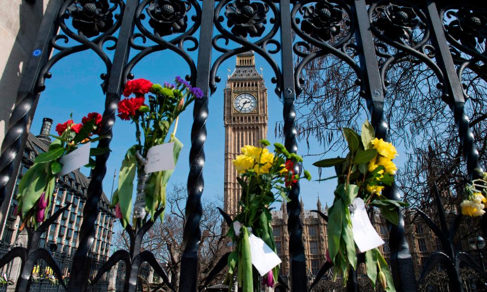 Floral tributes to the victims of the Westminster Bridge terror attack on the outside of the Houses of Parliament.