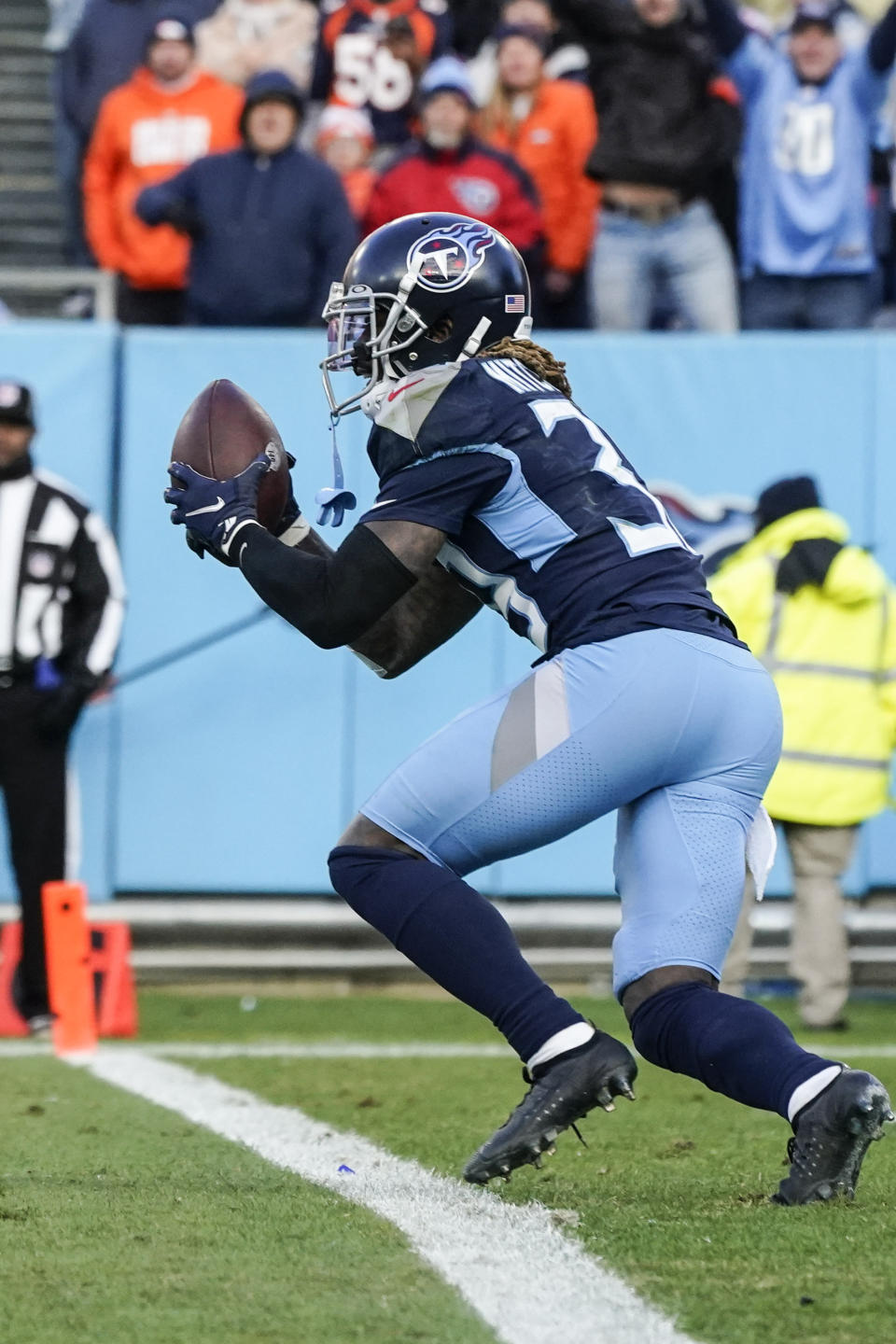 Tennessee Titans cornerback Terrance Mitchell (39) makes the pick against the Denver Broncos during the second half of an NFL football game, Sunday, Nov. 13, 2022, in Nashville, Tenn. The Tennessee Titans won 17-10. (AP Photo/Mark Humphrey)