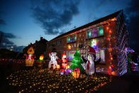 A mum has gone all out to cheer up her kids and neighbours by putting up her CHRISTMAS decorations three months early - including 3,000 outdoor lights. Caroline Gabe, 46, has been shielding with her children since March - and said putting up her tree and decorations in September was a much-needed boost. She has spent the year buying outdoor lights and installations - from as far away as America - and put them all up last week, on a whim. Almost all of them are outside - including 3,000 fairy lights, sparkling snow, an 8ft inflatable snowman, as well as Santa and his reindeer.