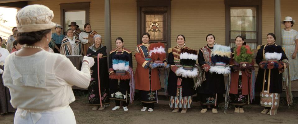 KILLERS OF THE FLOWER MOON, Jillian Dion (back, second from left), Lily Gladstone as Mollie Burkhart, (back, center left), 2023.  © Paramount Pictures /Courtesy Everett Collection