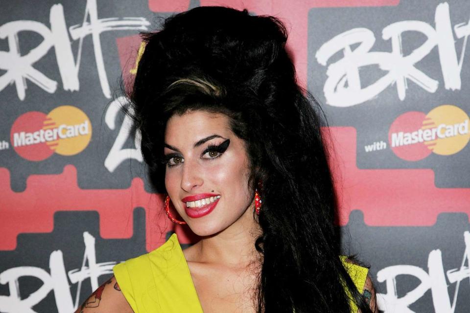 <p>Dave Hogan/Getty</p> Amy Winehouse