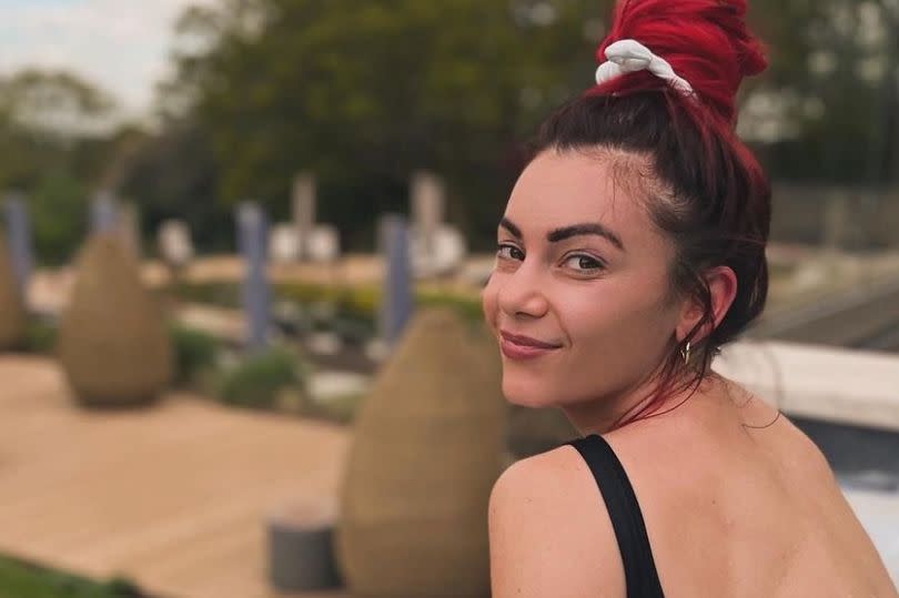 Dianne showed off her figure in a backless swimsuit