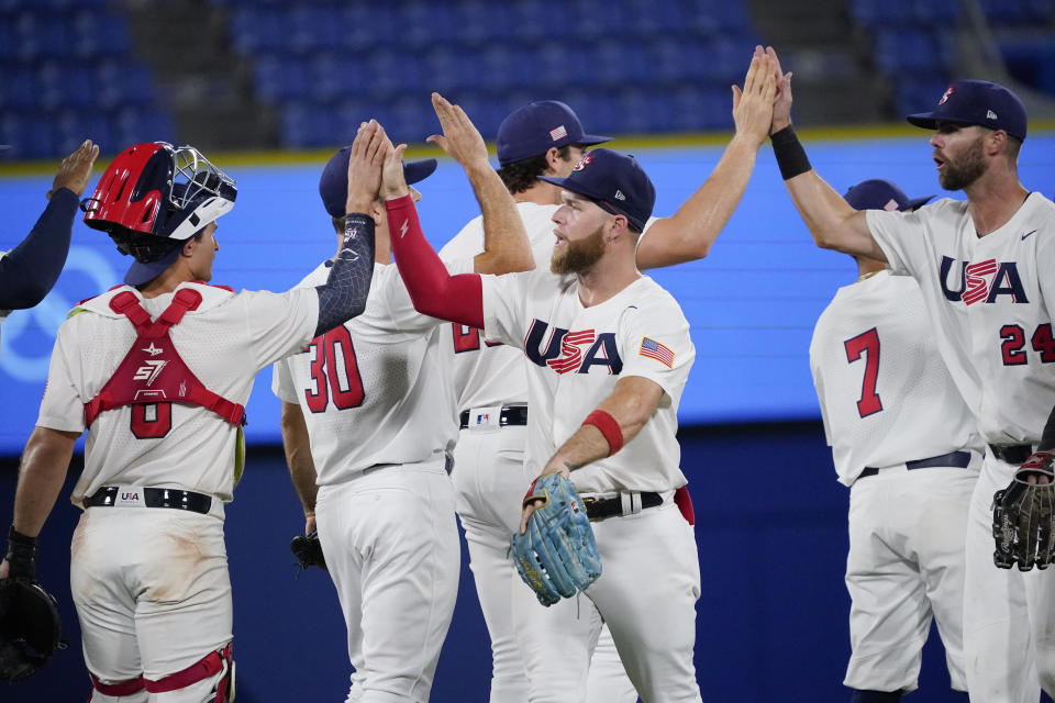 Team United States celebrate their win after a baseball game against South Korea at the 2020 Summer Olympics, Saturday, July 31, 2021, in Yokohama, Japan. United States won 4-2. (AP Photo/Sue Ogrocki)