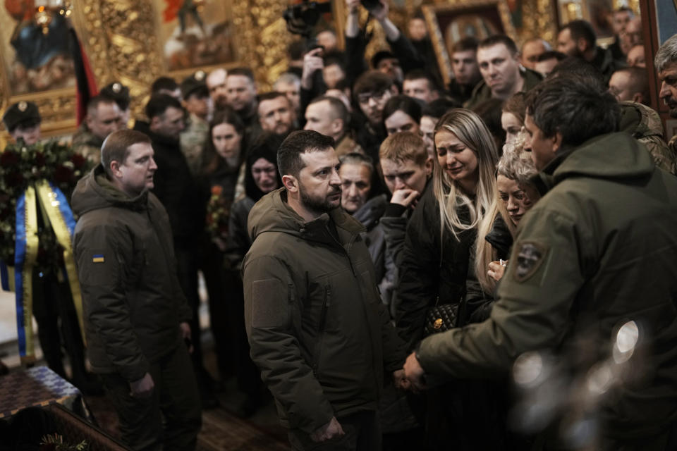 FILE - Ukrainian President Volodymyr Zelenskyy attends the funeral of Ukrainian officer Dmytro Kotsiubaylo, code-name "Da Vinci", at the St. Michael's Cathedral, in Kyiv, Ukraine, March 10, 2023. Russian threats to nuke Ukraine. China’s belligerent military moves around rival Taiwan, its growing ties with Moscow and its growing assertiveness throughout Asia. North Korea’s unprecedented run of weapons testing and development. The top diplomats from seven of the world’s most powerful countries will have plenty to discuss when they gather in the hot spring resort town of Karuizawa starting Sunday, April 16, 2023, for the Group of Seven foreign ministers’ summit. (AP Photo/Thibault Camus, File)