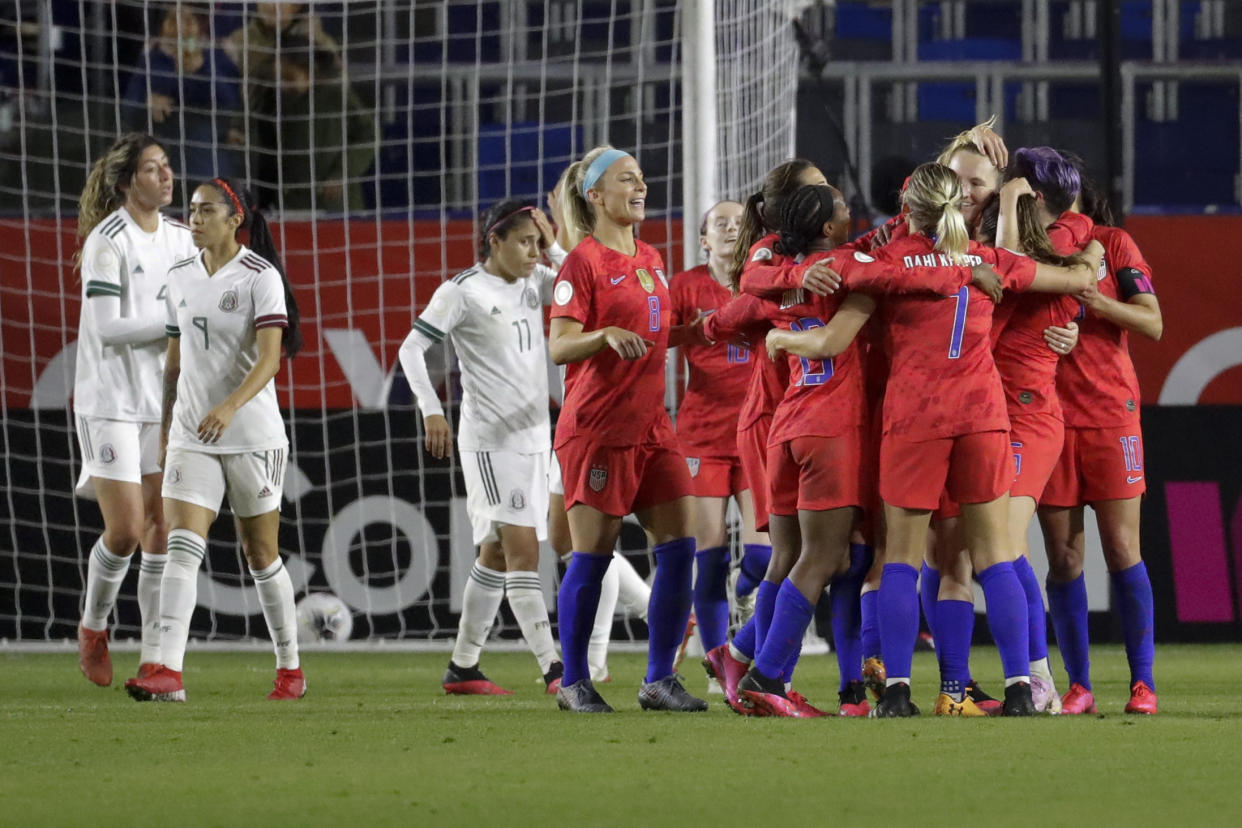 U.S. players celebrate a goal by midfielder Samantha Mewis during the second half of a CONCACAF women's Olympic qualifying soccer match against Mexico on Friday, Feb. 7, 2020, in Carson, Calif. (AP Photo/Chris Carlson)