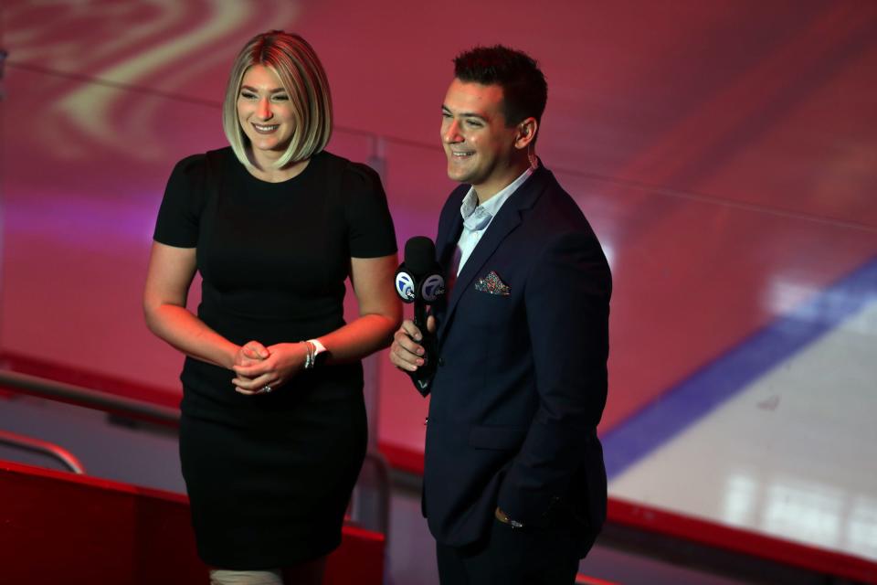 WXYZ sports reporters Jeanna Trotman and Brad Galli work the Red Wings season opener at Little Caesars Arena on Thursday, Oct. 14, 2021.